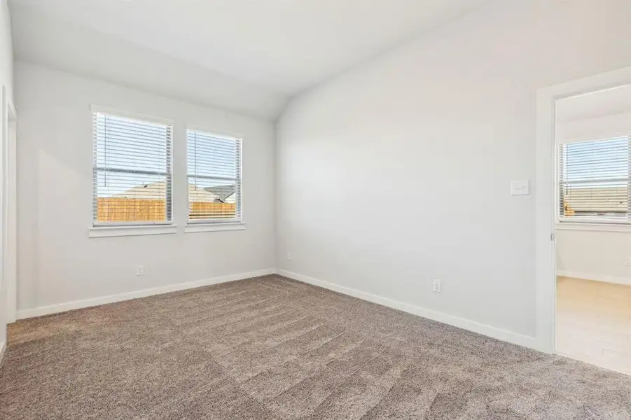 Bedroom in the Ash home plan by Trophy Signature Homes – REPRESENTATIVE PHOTO