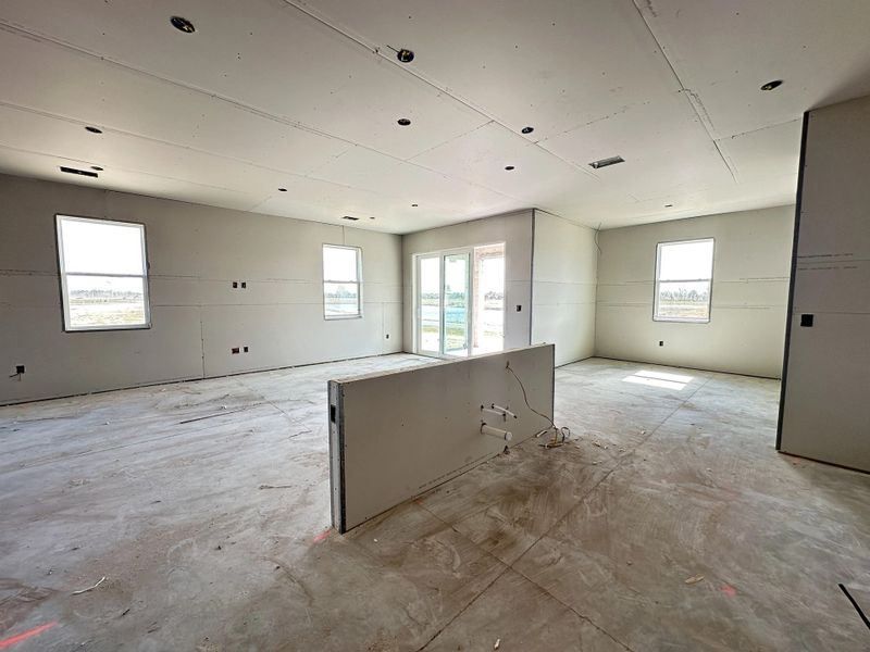 Kitchen opens up to the living space, large sliding glass doors and nook - under construction