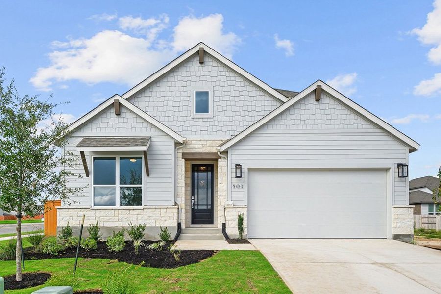 Front exterior of a new home in Lariat, Liberty Hill, TX, highlighting curb appeal (Image 1). Front exterior of a new home in Lariat, Liberty Hill, TX, highlighting curb appeal (Image 1).