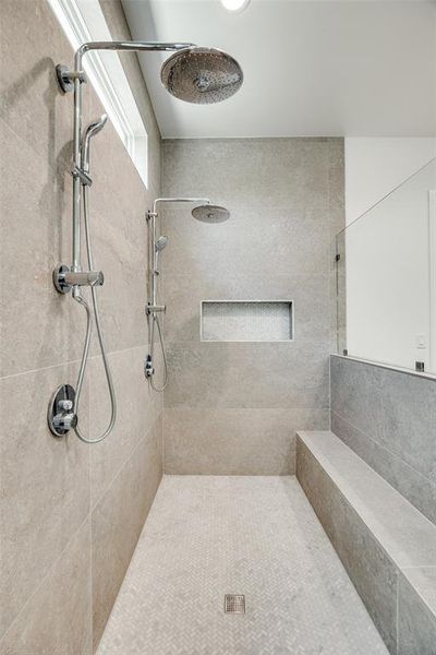 Bathroom featuring tiled shower Bathroom featuring tiled shower