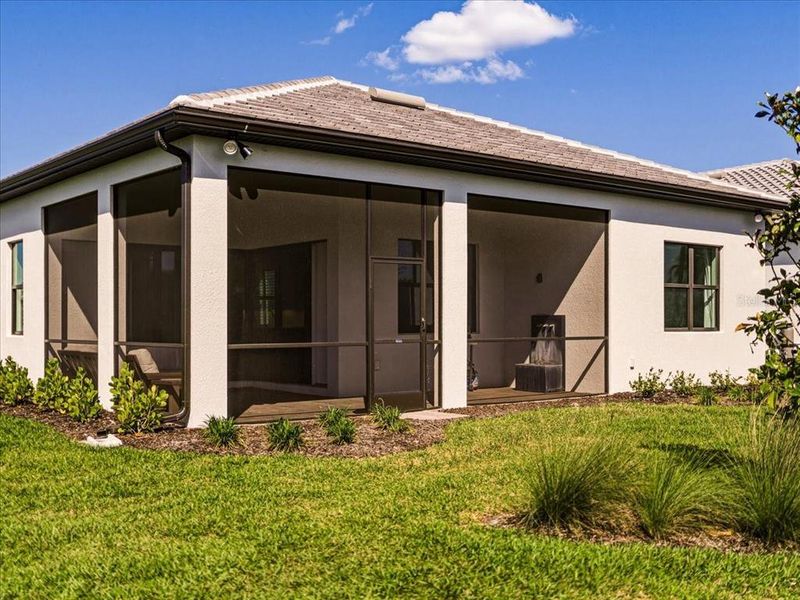 Exterior details and patio area of a home in Talon Preserve on Palmer Ranch, Nokomis (Image 38).