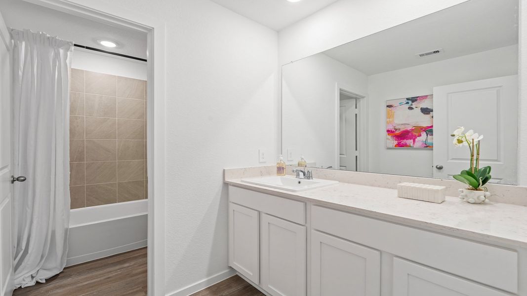 Representative furnished interior of a home built from the Rosemont by D.R. Horton in Sunterra Lakes, Brookshire (Image 37).
