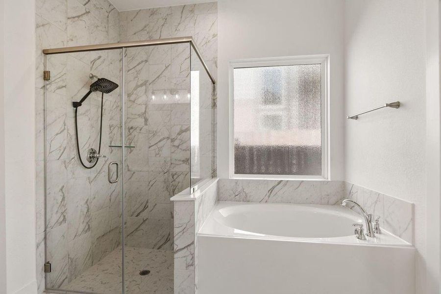 The Primary Bath features both anoversized shower and an inviting deepsoaker tub—the perfect duo for gettingready or winding down. The Primary Bath features both anoversized shower and an inviting deepsoaker tub—the perfect duo for gettingready or winding down.