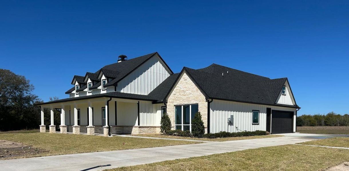 Front exterior of a new home in , Sealy, TX, highlighting curb appeal (Image 17). Front exterior of a new home in , Sealy, TX, highlighting curb appeal (Image 17).