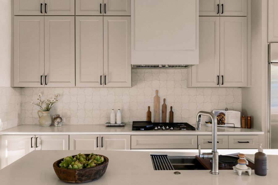 Kitchen with white cabinets and backsplash Kitchen with white cabinets and backsplash