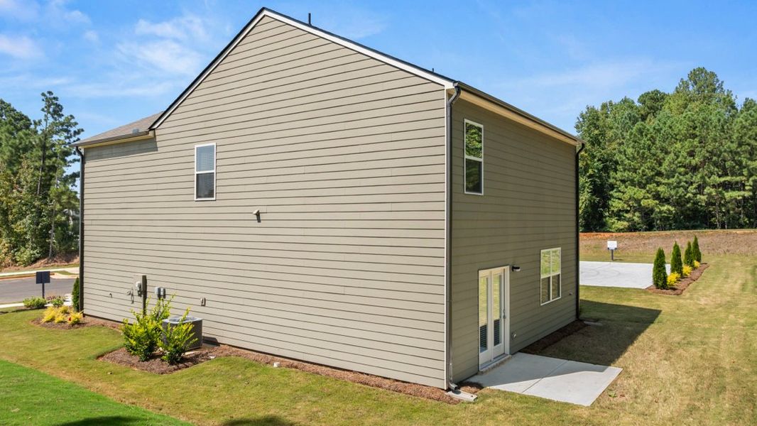 Representative exterior photo of a completed home built from the AISLE by D.R. Horton in Pointe Park, Union City, GA (Image 24).