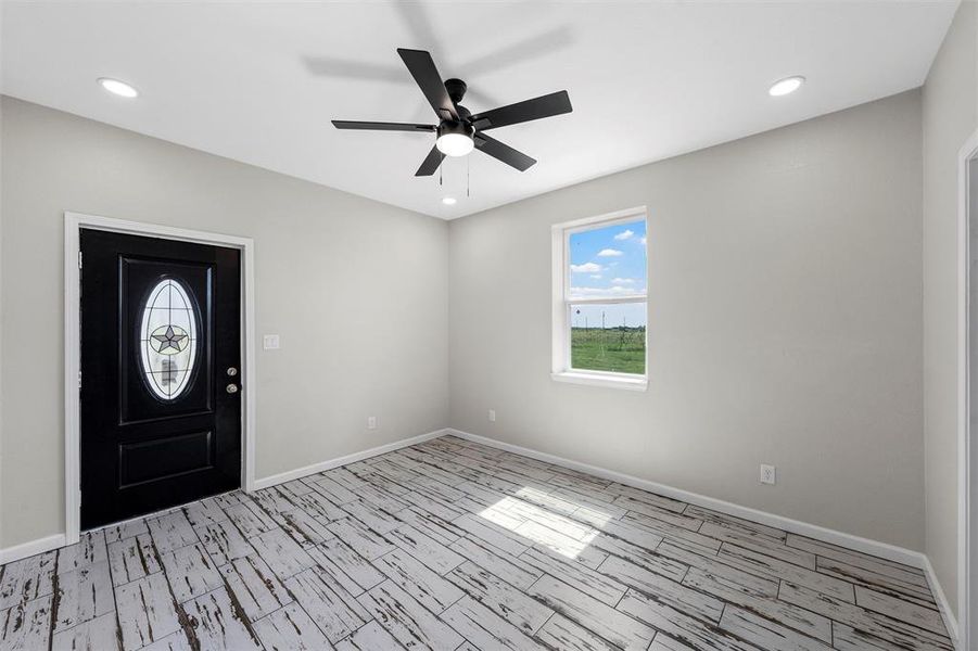 Entrance foyer with recessed lighting, wood tiled floors, and ceiling fan Entrance foyer with recessed lighting, wood tiled floors, and ceiling fan