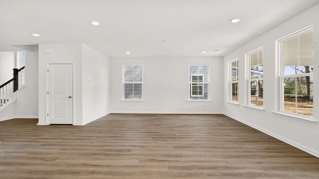 Comfortable living room filled with bright windows