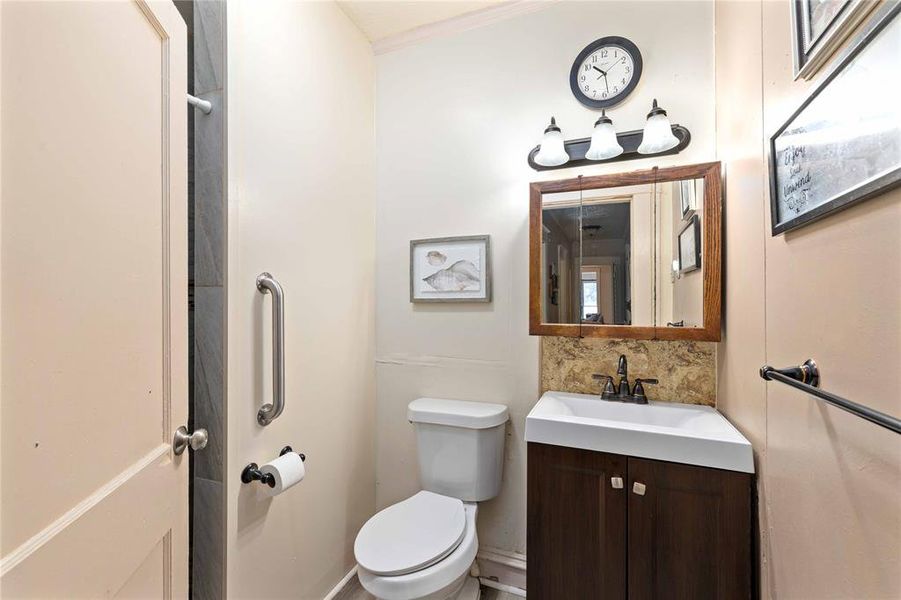 Full bathroom with walk-in shower.