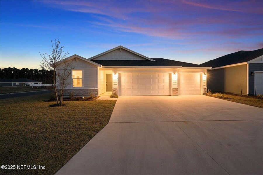 Front exterior of a new home in Azalea Creek, Jacksonville, FL, highlighting curb appeal (Image 20).