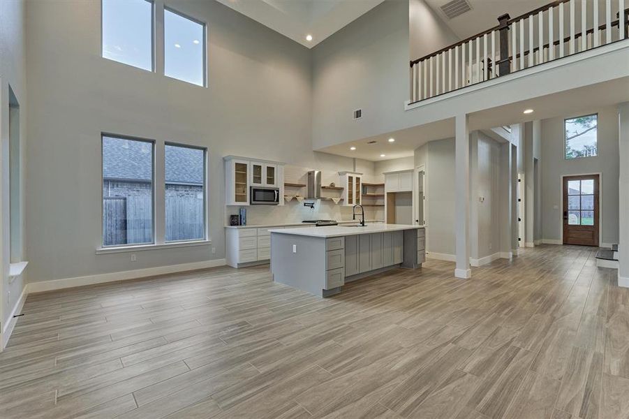 The large kitchen island provides additional space for seating and storage.