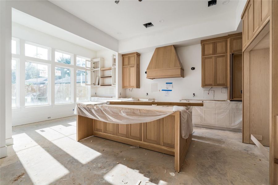 This stunning kitchen features white oak custom cabinetry, built in 30" column fridge and freezer, 48" dual fuel range, Brazilian Taj Mahal Quartzite (natural stone) counter and backsplash, and bar area with wine fridge. This stunning kitchen features white oak custom cabinetry, built in 30" column fridge and freezer, 48" dual fuel range, Brazilian Taj Mahal Quartzite (natural stone) counter and backsplash, and bar area with wine fridge.