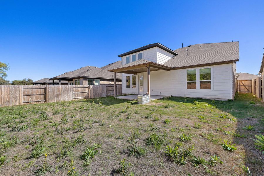 Enjoy rare backyard privacy as this home backs to heavily wooded land protected by a conservation easement and held in trust.