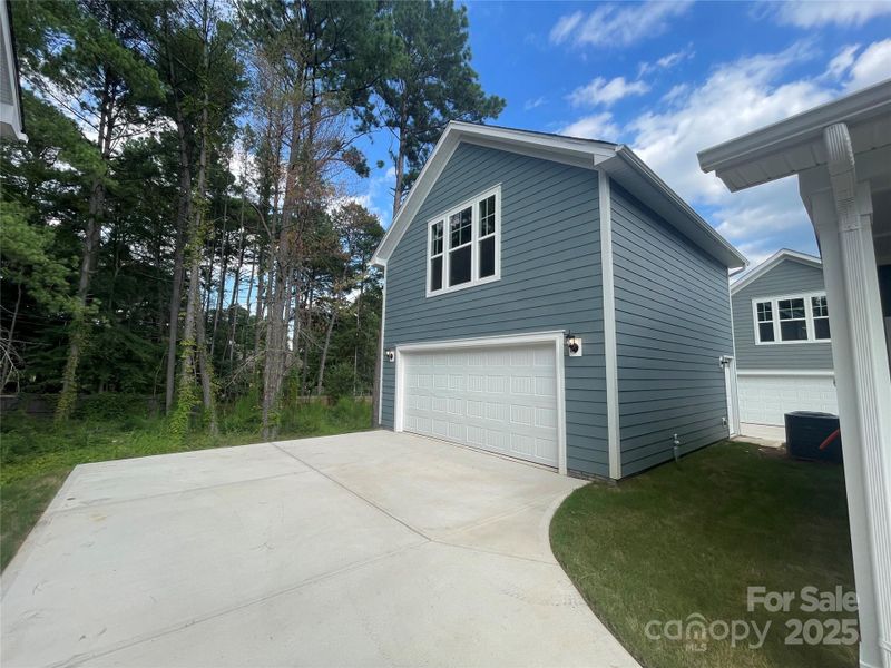 Front exterior of a new home in Arbor Village, Matthews, NC, highlighting curb appeal (Image 15). Front exterior of a new home in Arbor Village, Matthews, NC, highlighting curb appeal (Image 15).