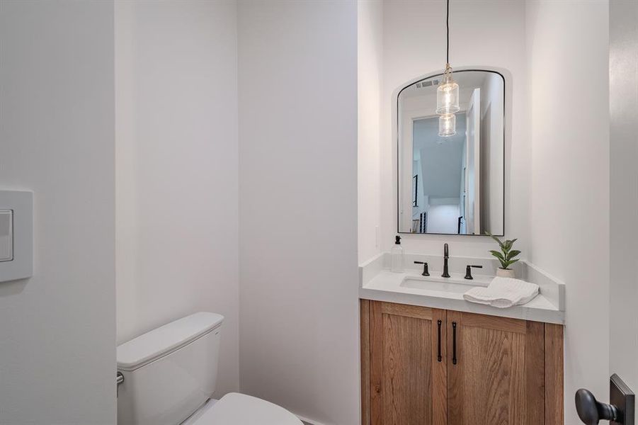 Bathroom featuring vanity and toilet