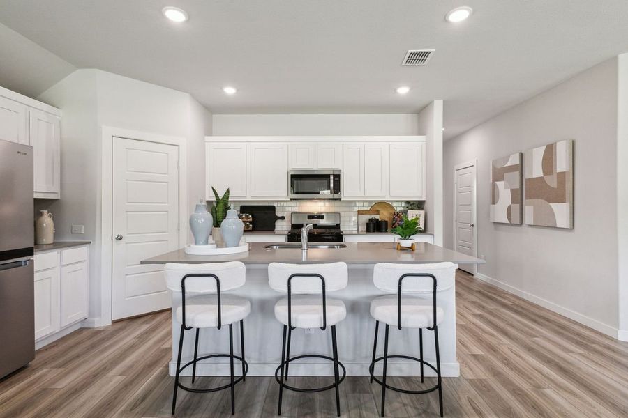 Kitchen in the Emmy II home plan by Trophy Signature Homes