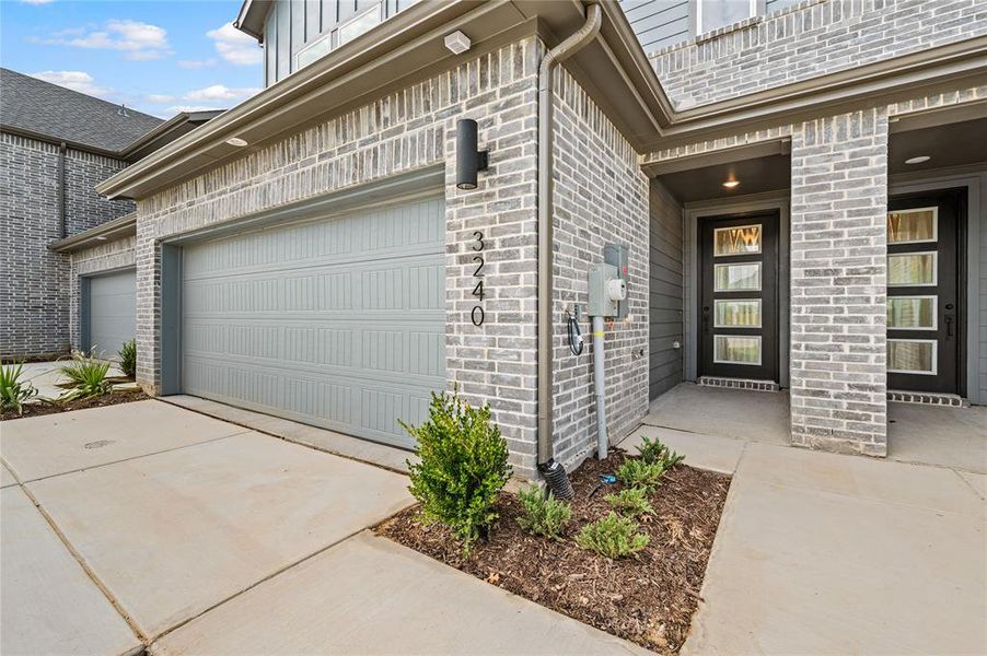Front exterior of a new home in Enclave at Chadwick Farms, Northlake, TX, highlighting curb appeal (Image 11). Front exterior of a new home in Enclave at Chadwick Farms, Northlake, TX, highlighting curb appeal (Image 11).