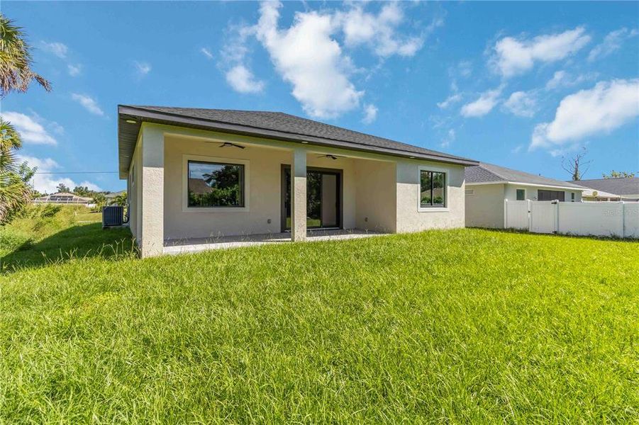 Front exterior of a new home in , Rotonda West, FL, highlighting curb appeal (Image 1).