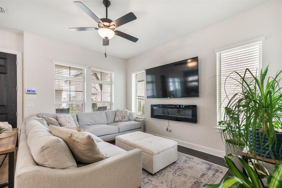 Living area featuring a ceiling fan and wood finished floors