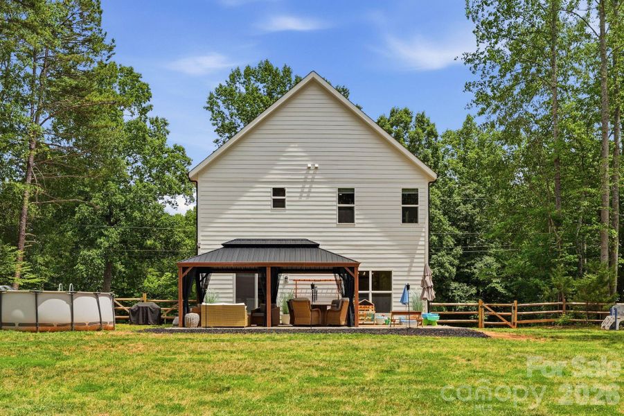 Exterior details and patio area of a home in , Troutman (Image 4).