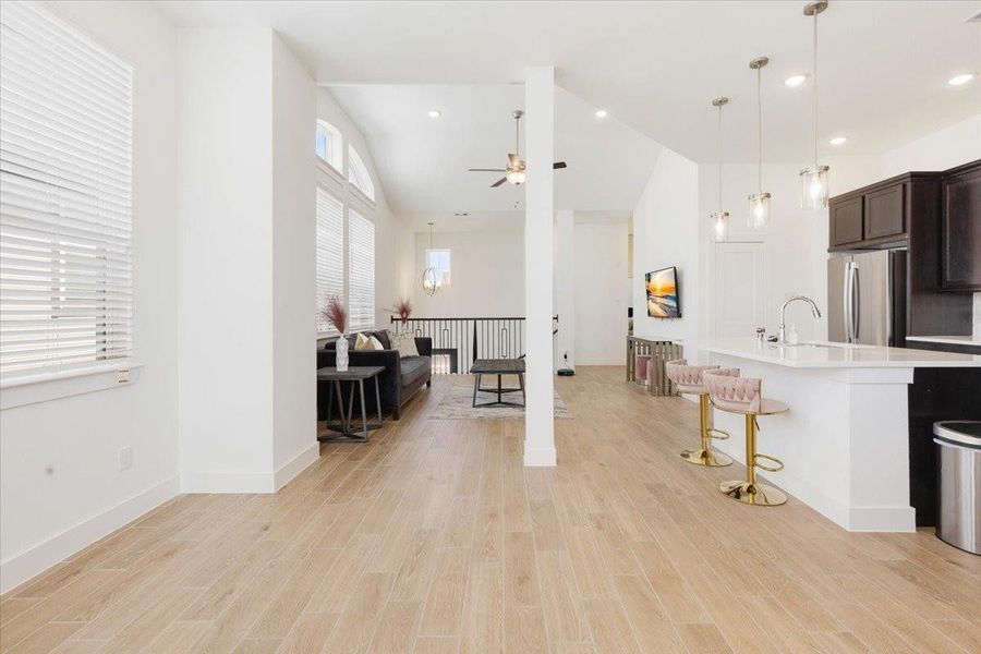 Furnished interior view inside a new home in Meridiana, Iowa Colony (Image 9).
