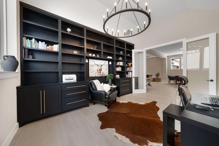 The chic chandelier hangs above, casting a warm glow over the space, creating a productive yet inviting atmosphere. With large windows letting in plenty of natural light, the room feels open and bright. The chic chandelier hangs above, casting a warm glow over the space, creating a productive yet inviting atmosphere. With large windows letting in plenty of natural light, the room feels open and bright.