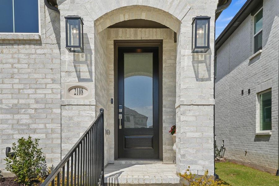 Exterior details and patio area of a home in Pecan Square, Northlake (Image 2). Exterior details and patio area of a home in Pecan Square, Northlake (Image 2).