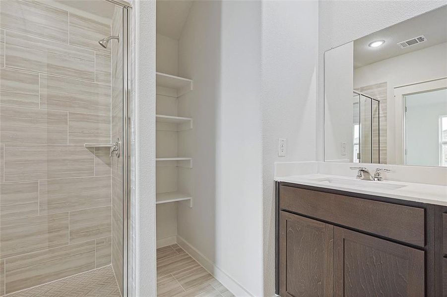 Bathroom with vanity and walk in shower