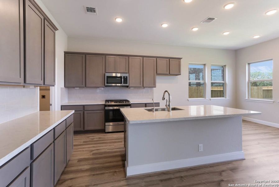 Furnished interior view inside a new home in Buffalo Crossing – New Phase Now Preselling, Cibolo (Image 6).