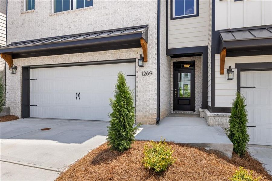 Front exterior of a new home in , Cumming, GA, highlighting curb appeal (Image 1).