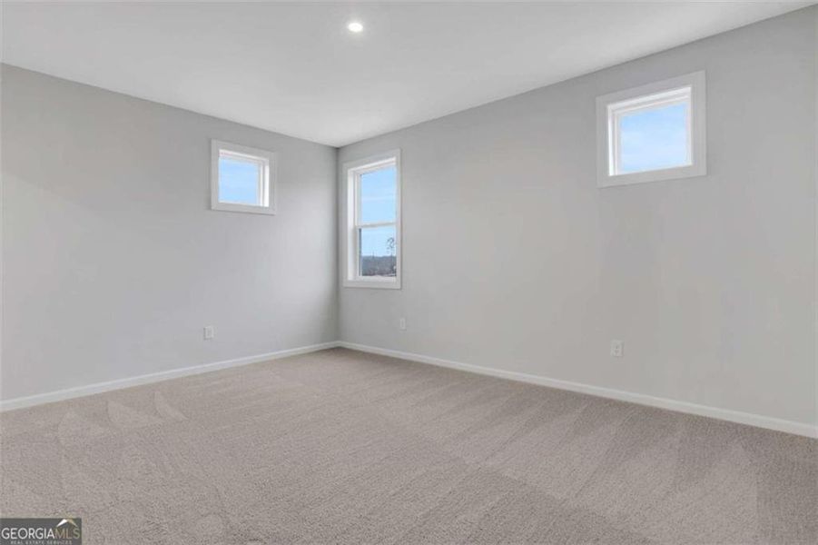 Spacious, unfurnished interior of a new home in The Paddocks at Doc Hughes, Buford (Image 49).