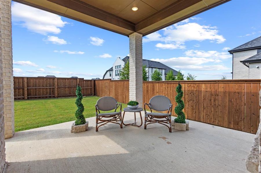 Fenced backyard featuring a patio area