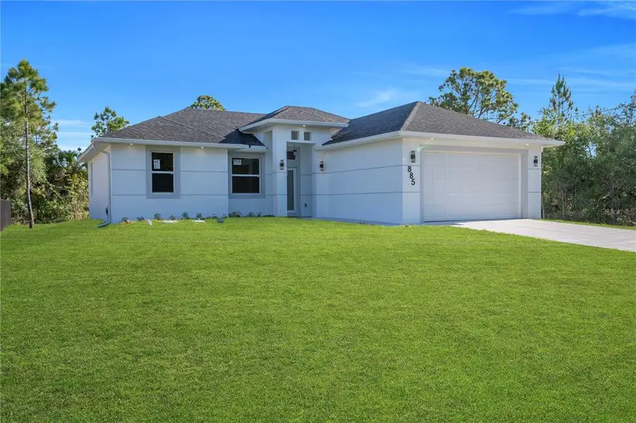 Front exterior of a new home in , Lehigh Acres, FL, highlighting curb appeal (Image 2). Front exterior of a new home in , Lehigh Acres, FL, highlighting curb appeal (Image 2).