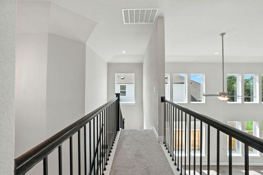 Hall with plenty of natural light, an upstairs landing, and recessed lighting Hall with plenty of natural light, an upstairs landing, and recessed lighting