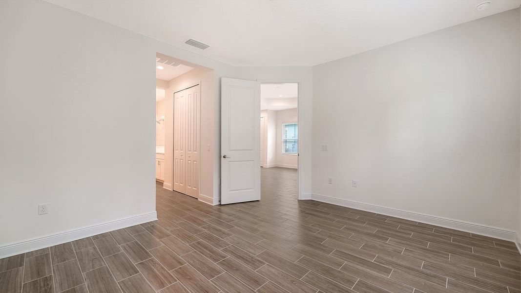 Spacious, unfurnished interior of a new home in Wildleaf Real Estate and Homes for Sale in Parrish, FL - Neal Communities, Parrish (Image 16). Spacious, unfurnished interior of a new home in Wildleaf Real Estate and Homes for Sale in Parrish, FL - Neal Communities, Parrish (Image 16).