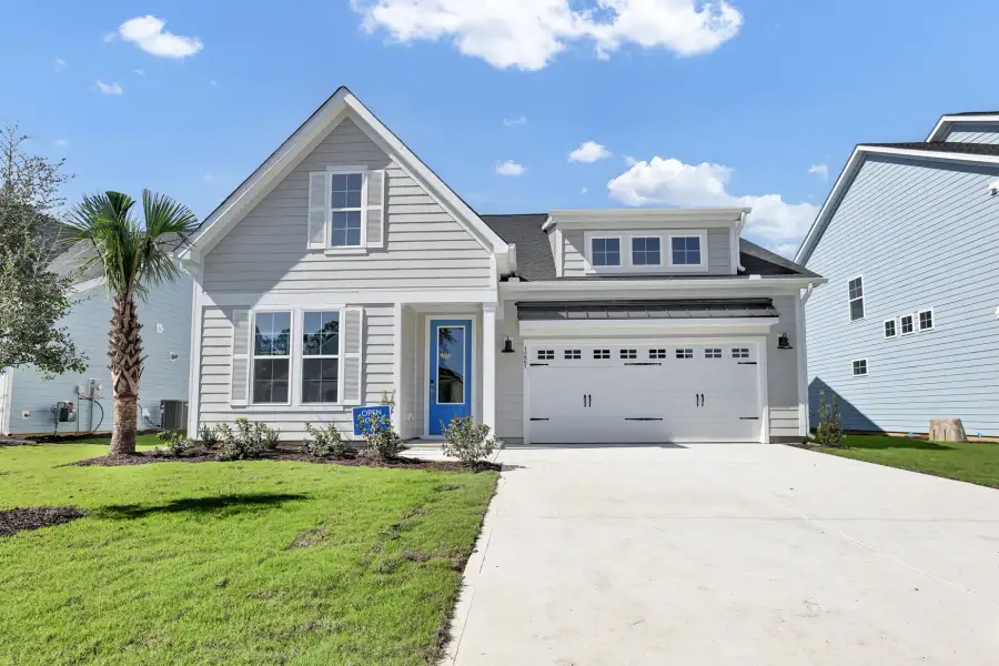 Front exterior of a new home in Grand Park, Leland, NC, highlighting curb appeal (Image 1). Front exterior of a new home in Grand Park, Leland, NC, highlighting curb appeal (Image 1).