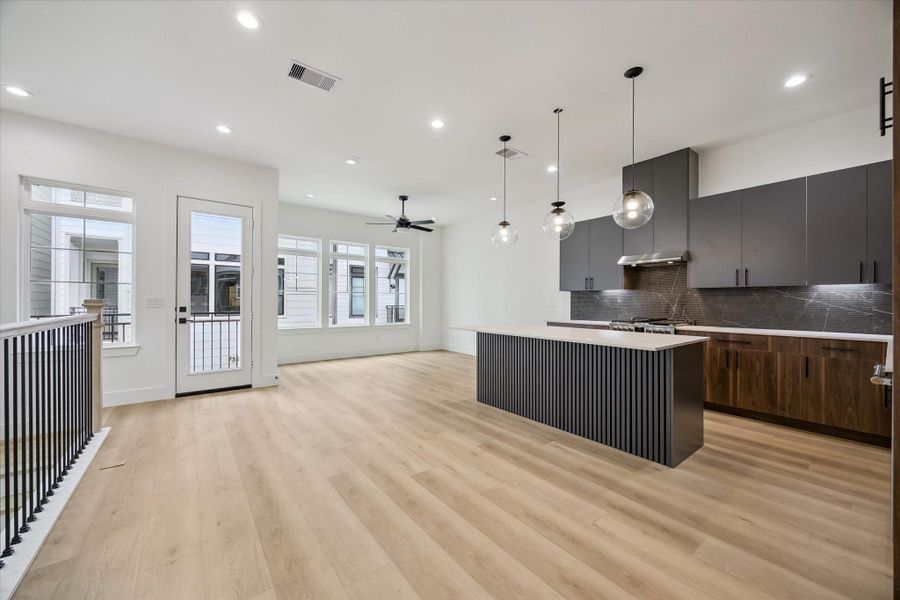 Wide-open main living space with kitchen, dining, and entertaining flow