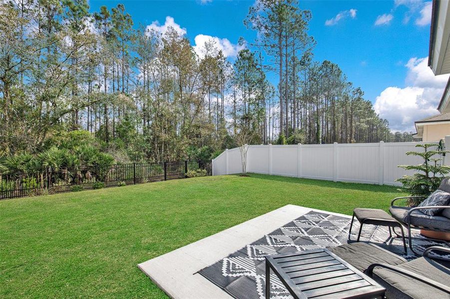 Exterior details and patio area of a home in Sawmill Branch, Palm Coast (Image 27).