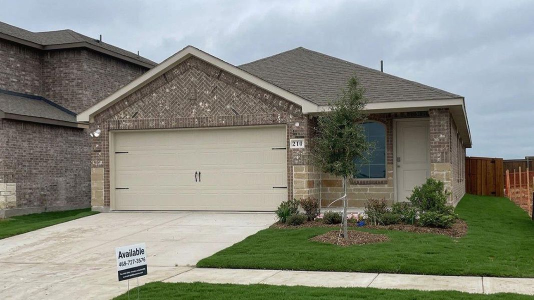 Front exterior of a new home in Northspur, Terrell, TX, highlighting curb appeal (Image 1). Front exterior of a new home in Northspur, Terrell, TX, highlighting curb appeal (Image 1).