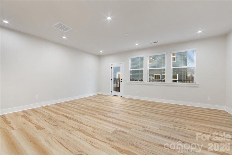 Great Room Wrapped in Durable and Easy to Maintain Flooring.