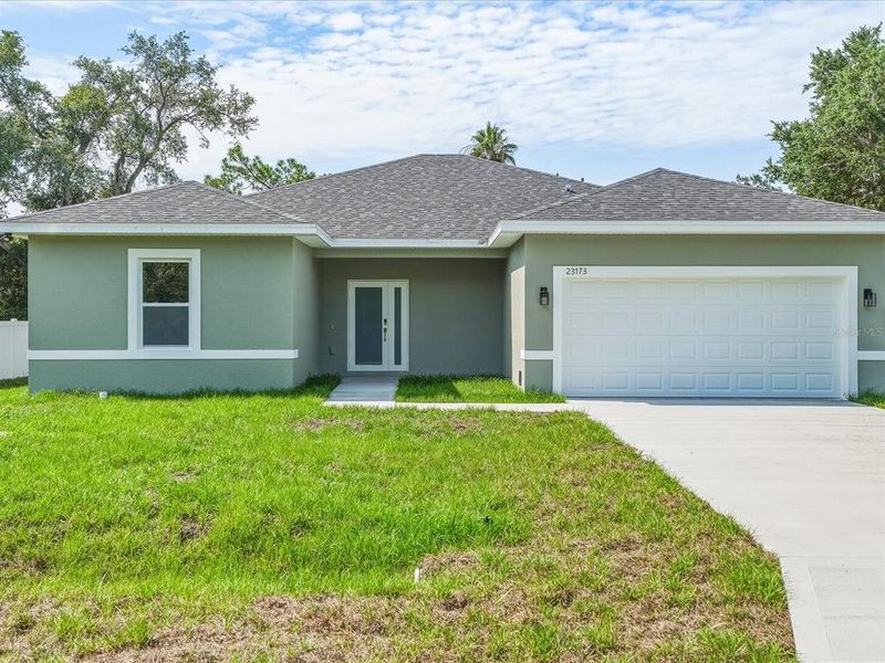 Front exterior of a new home in , Punta Gorda, FL, highlighting curb appeal (Image 2). Front exterior of a new home in , Punta Gorda, FL, highlighting curb appeal (Image 2).