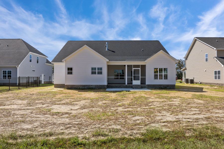 Exterior details and patio area of a home in The Preserve at Langston, Winterville (Image 31).