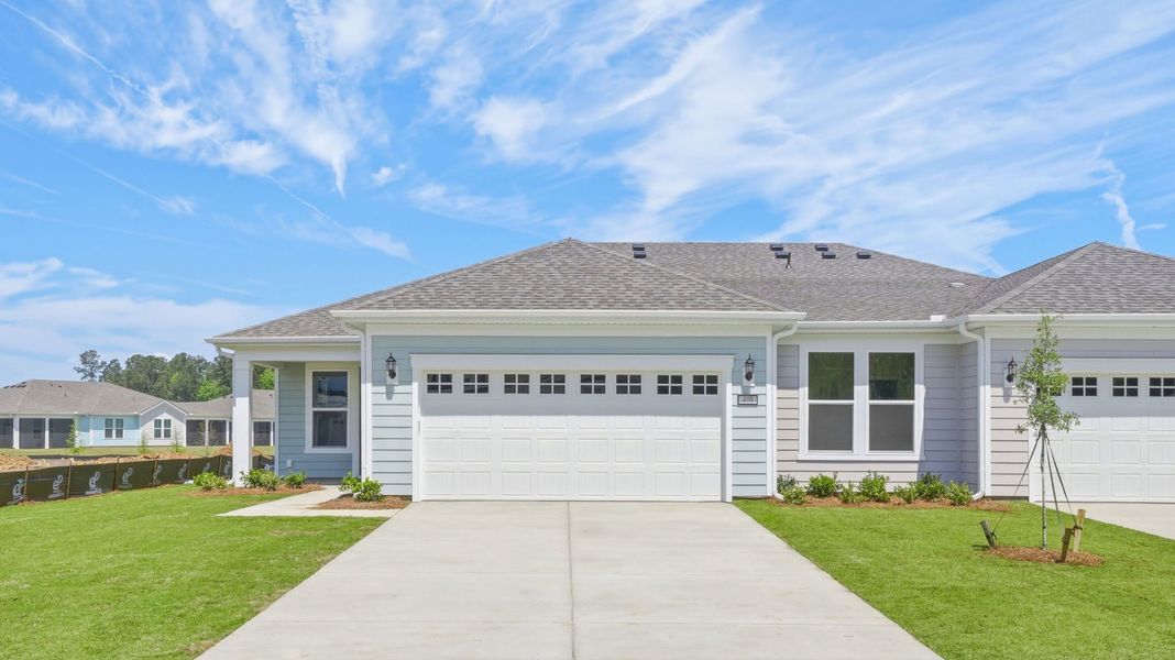 Front exterior of a new home in Sun City Hilton Head, Bluffton, SC, highlighting curb appeal (Image 1). Front exterior of a new home in Sun City Hilton Head, Bluffton, SC, highlighting curb appeal (Image 1).
