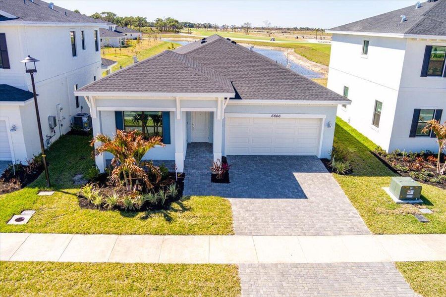 This new single-story home provides ease-of-living with ample room to grow. Down the foyer is a shared open-concept layout situated between the kitchen, dining room and Great Room, with glass-sliders leading out to the covered lanai. On the opposite side of the home are three secondary bedrooms and a privately situated owner’s suite with an adjoining bathroom. A versatile two-car garage provides storage room. Prices, dimensions and features may vary and are subject to change. Photos are for illustrative purposes only. This new single-story home provides ease-of-living with ample room to grow. Down the foyer is a shared open-concept layout situated between the kitchen, dining room and Great Room, with glass-sliders leading out to the covered lanai. On the opposite side of the home are three secondary bedrooms and a privately situated owner’s suite with an adjoining bathroom. A versatile two-car garage provides storage room. Prices, dimensions and features may vary and are subject to change. Photos are for illustrative purposes only.