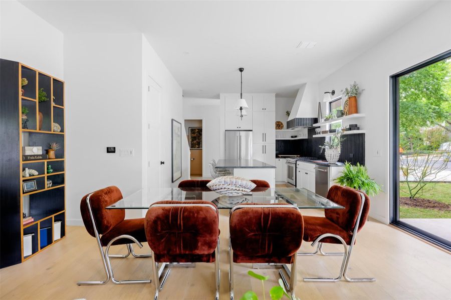 Dining area with light wood-type flooring