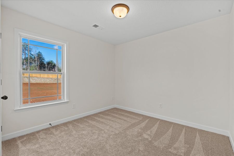 Representative unfurnished interior of a home built from the Cheshire by Enchanted Homes in Hampshire Heights, Moore (Image 18).
