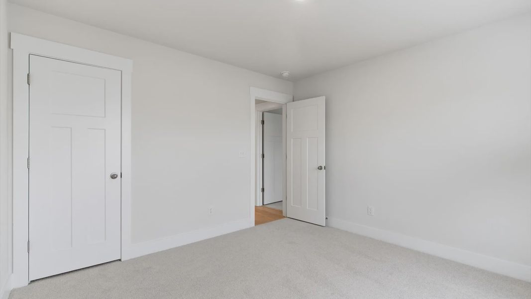 Well-designed space offering plush carpet underfoot and a thoughtfully planned walk-in closet in Greenville, SC