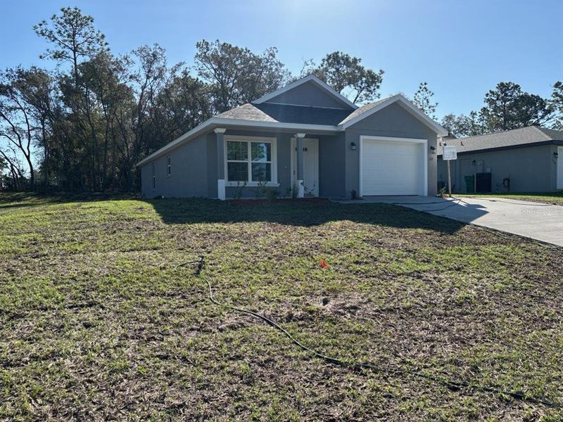 Front exterior of a new home in , Citrus Springs, FL, highlighting curb appeal (Image 17).