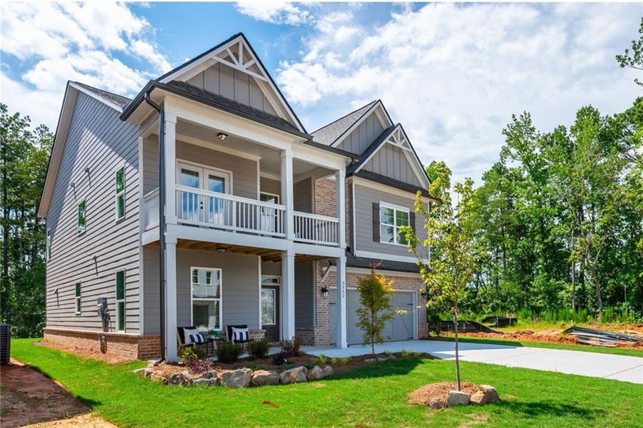 Front exterior of a new home in , Flowery Branch, GA, highlighting curb appeal (Image 2). Front exterior of a new home in , Flowery Branch, GA, highlighting curb appeal (Image 2).