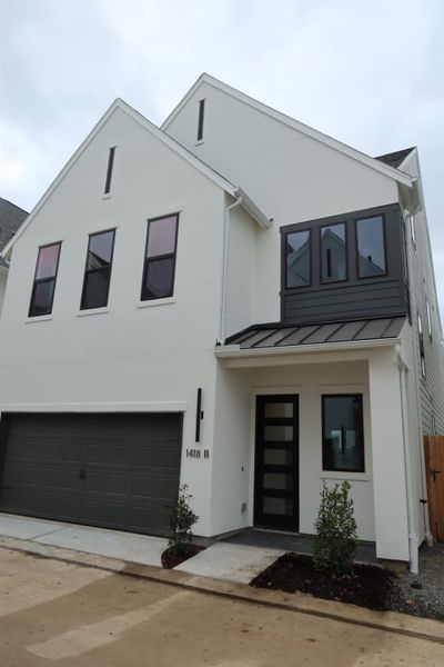 Front exterior of a new home in Caywood Place, Houston, TX, highlighting curb appeal (Image 2). Front exterior of a new home in Caywood Place, Houston, TX, highlighting curb appeal (Image 2).